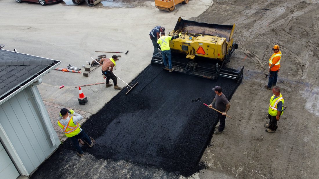 Overhead paving crew detail with asphalt equipment
