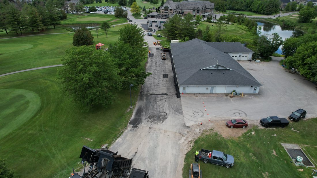 Wide aerial overview of the Deer Creek property and site work